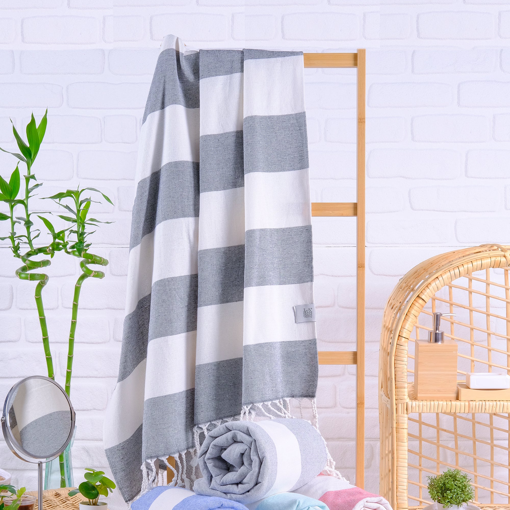 Violet Beach Towel made of soft Turkish cotton with white fringes, perfect for beach or home use.