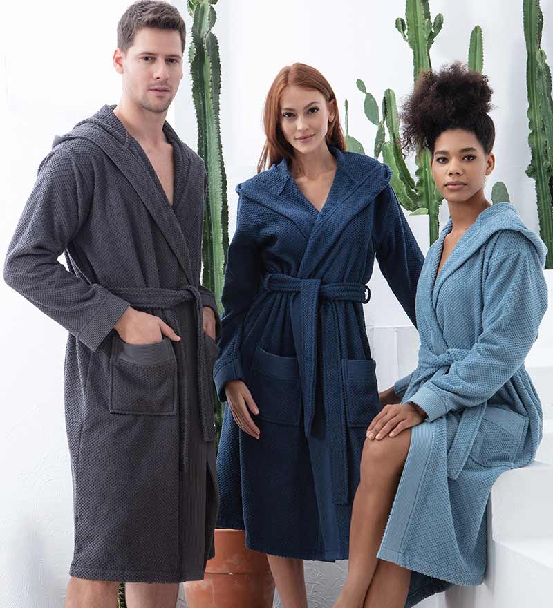 A luxurious Women's Hooded Turkish Cotton Terry Cloth Robe in calming colors, featuring a soft hood, large pockets, and a stylish belt.