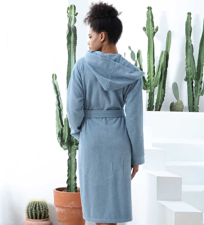 A luxurious Women's Hooded Turkish Cotton Terry Cloth Robe in calming colors, featuring a soft hood, large pockets, and a stylish belt.