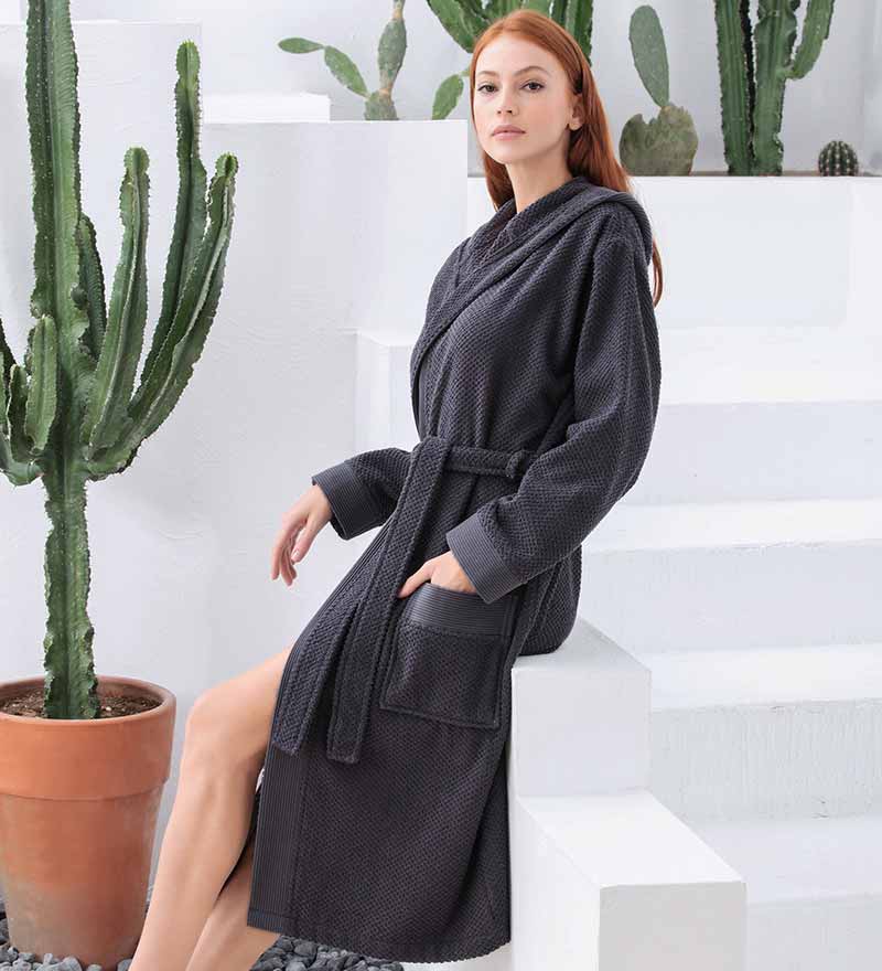 A luxurious Women's Hooded Turkish Cotton Terry Cloth Robe in calming colors, featuring a soft hood, large pockets, and a stylish belt.