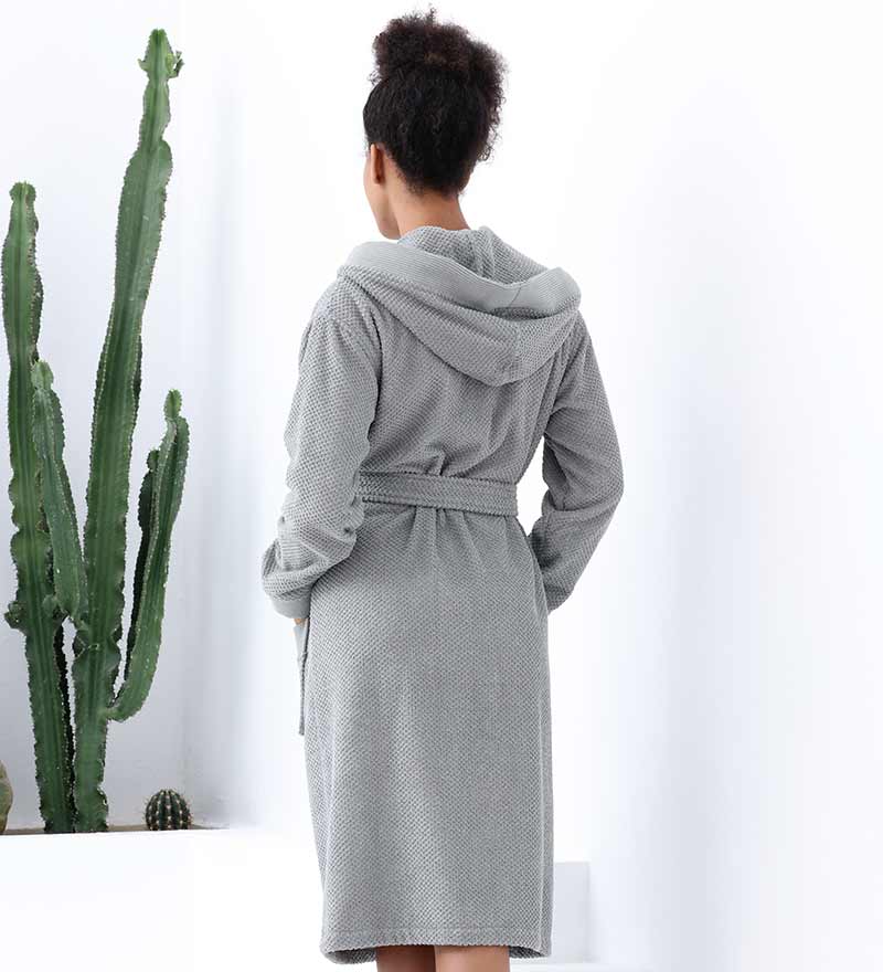 A luxurious Women's Hooded Turkish Cotton Terry Cloth Robe in calming colors, featuring a soft hood, large pockets, and a stylish belt.