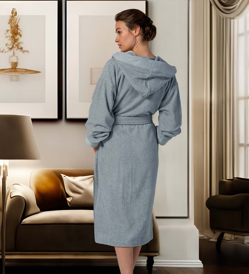 A luxurious Women's Hooded Turkish Cotton Terry Cloth Robe in calming colors, featuring a soft hood, large pockets, and a stylish belt.