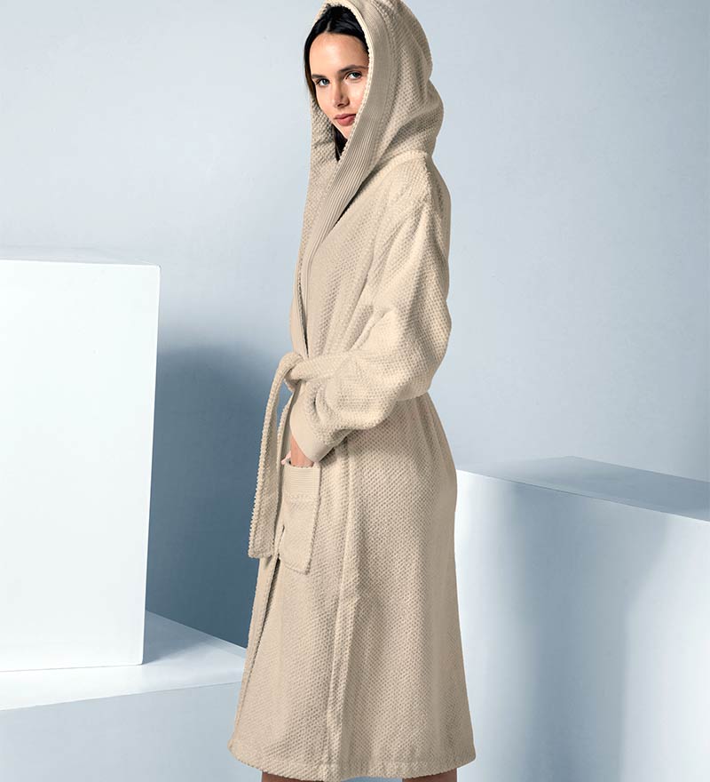 A luxurious Women's Hooded Turkish Cotton Terry Cloth Robe in calming colors, featuring a soft hood, large pockets, and a stylish belt.