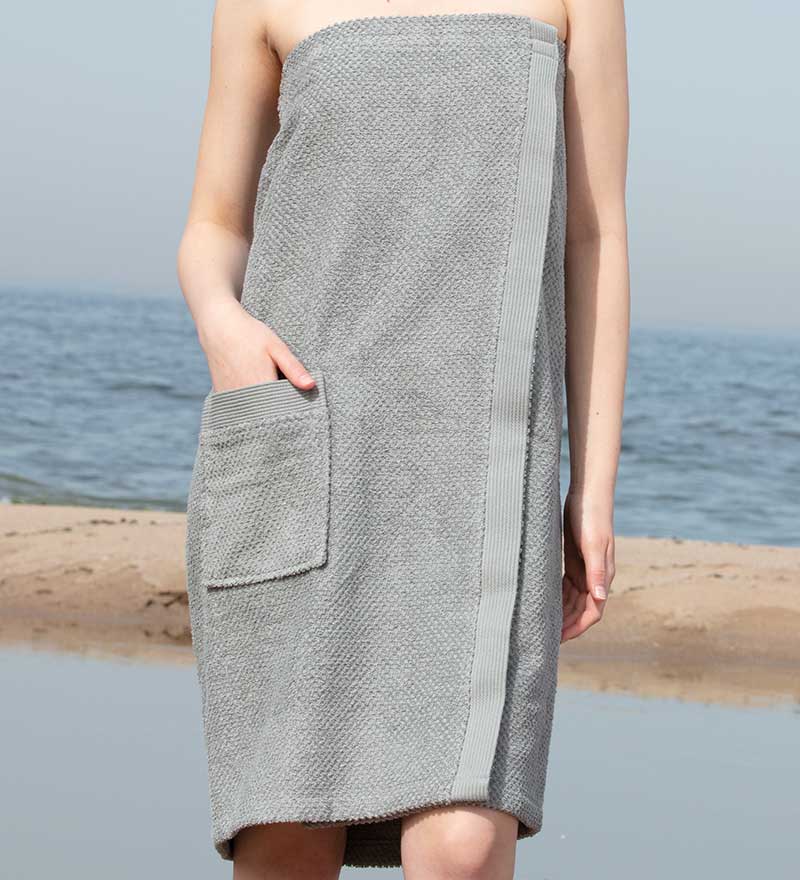 Women's Turkish Cotton Towel Wrap in various colors, showcasing its soft texture and adjustable closure.