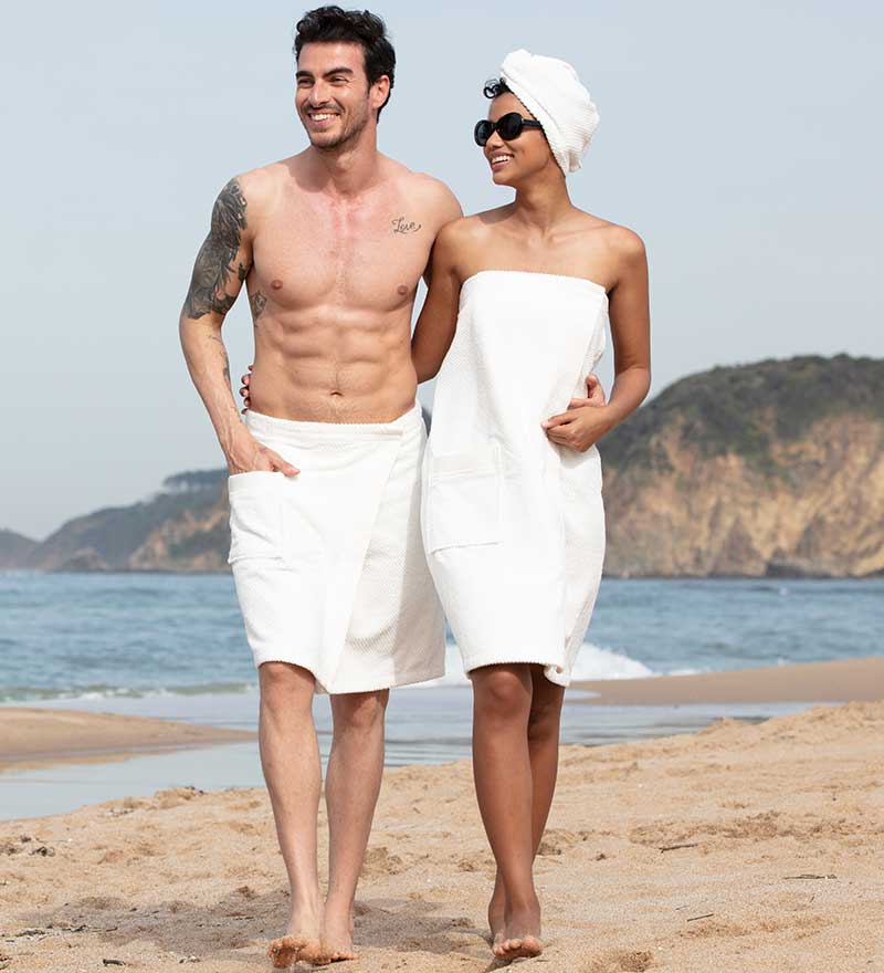 Women's Turkish Cotton Towel Wrap in various colors, showcasing its soft texture and adjustable closure.