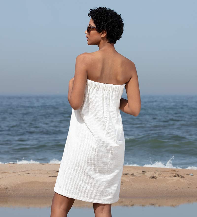 Women's Turkish Cotton Towel Wrap in various colors, showcasing its soft texture and adjustable closure.