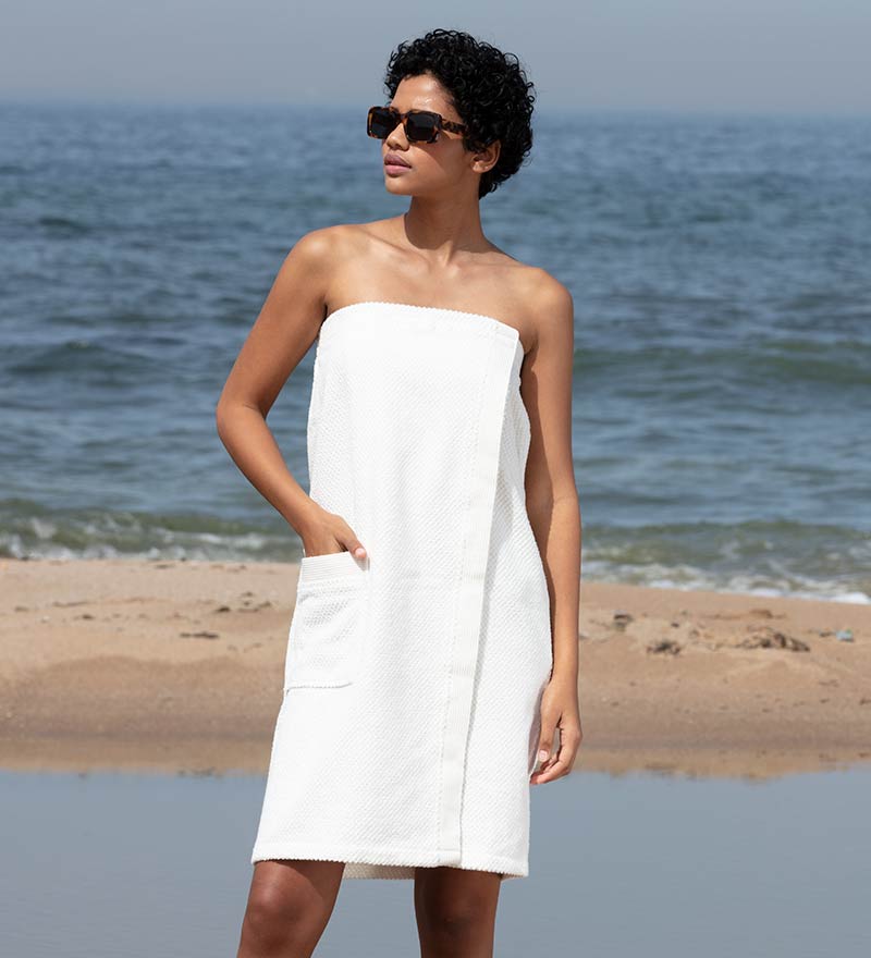 Women's Turkish Cotton Towel Wrap in various colors, showcasing its soft texture and adjustable closure.