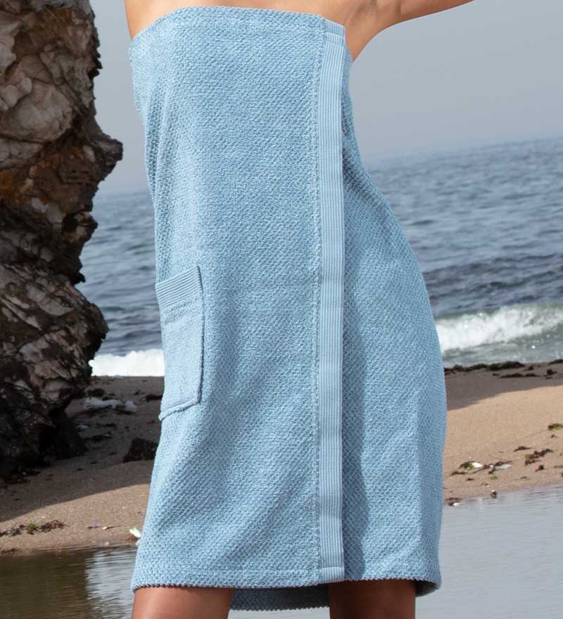 Women's Turkish Cotton Towel Wrap in various colors, showcasing its soft texture and adjustable closure.