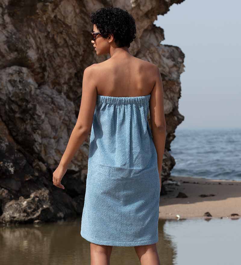 Women's Turkish Cotton Towel Wrap in various colors, showcasing its soft texture and adjustable closure.