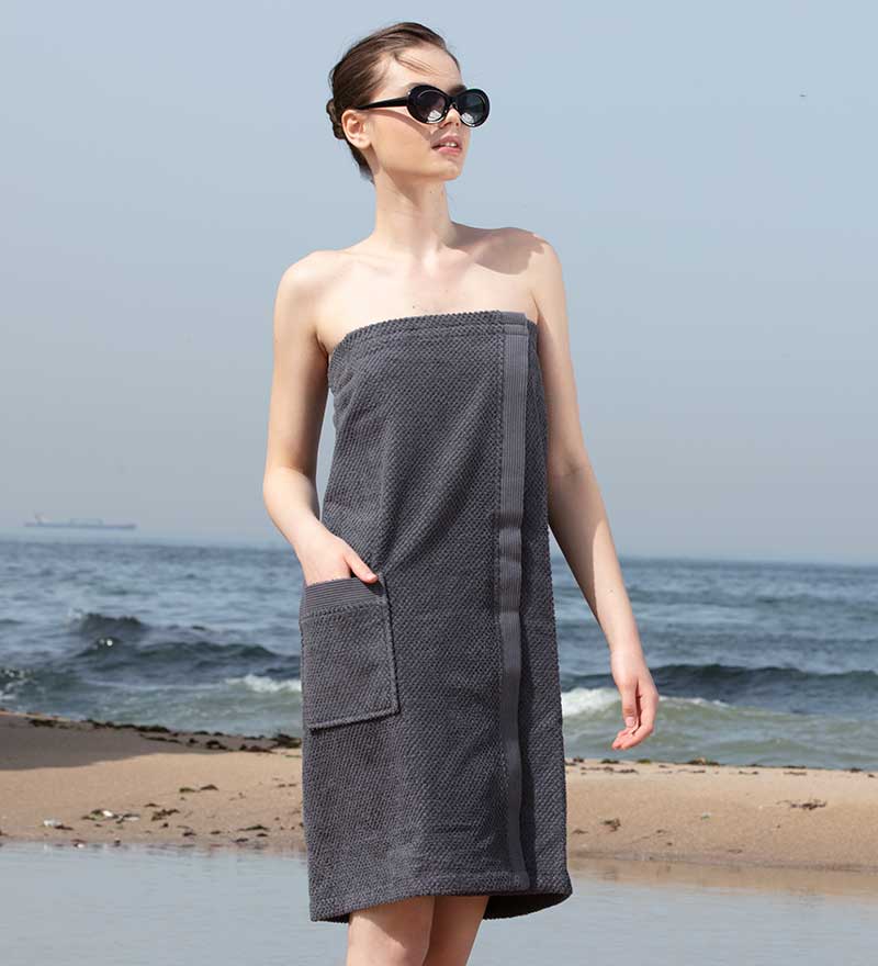 Women's Turkish Cotton Towel Wrap in various colors, showcasing its soft texture and adjustable closure.