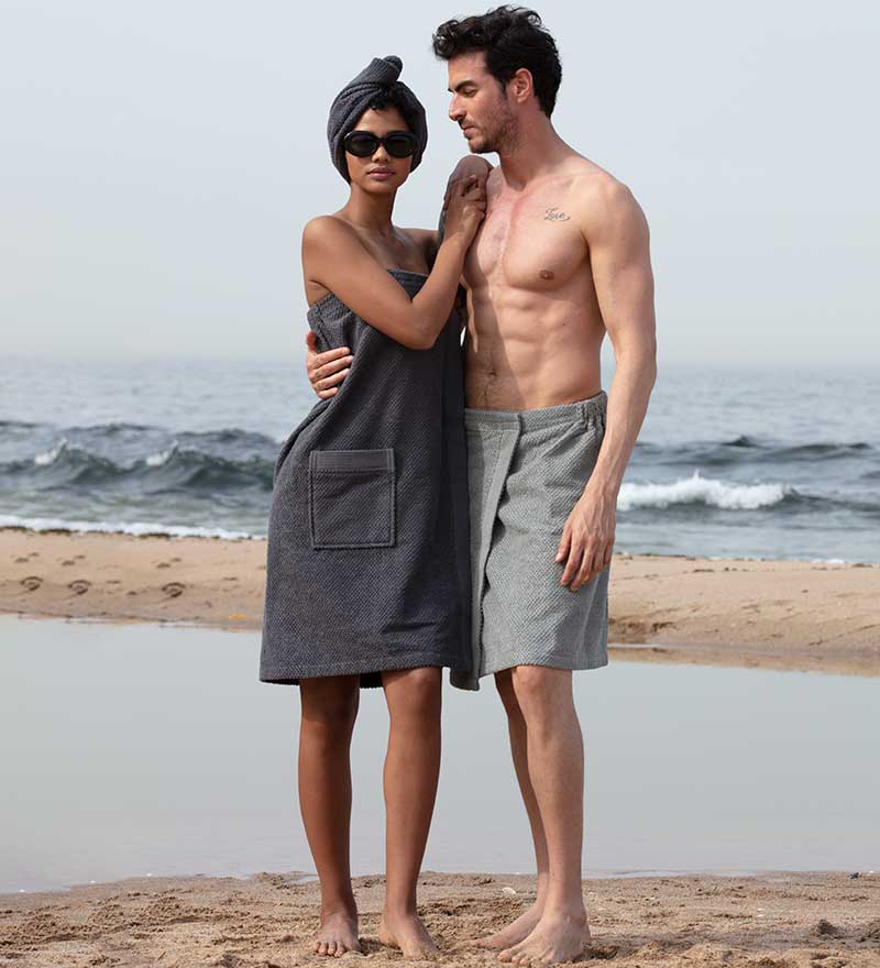 Women's Turkish Cotton Towel Wrap in various colors, showcasing its soft texture and adjustable closure.