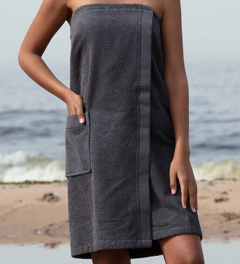 Women's Turkish Cotton Towel Wrap in various colors, showcasing its soft texture and adjustable closure.