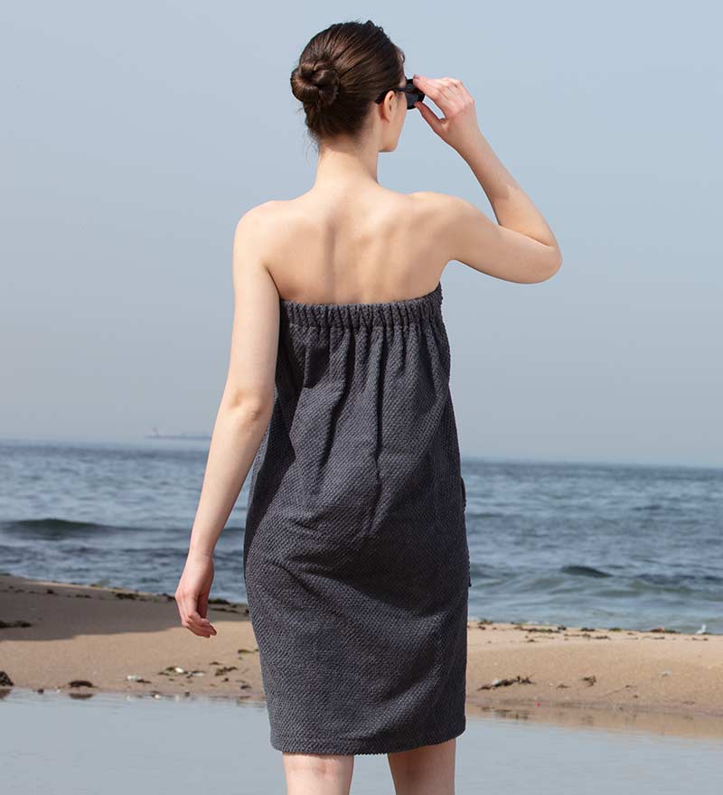 Women's Turkish Cotton Towel Wrap in various colors, showcasing its soft texture and adjustable closure.