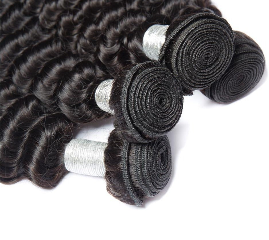 10A Grade Deep Wave Brazilian Human Hair Bundles in natural black color, showcasing luxurious texture and volume.