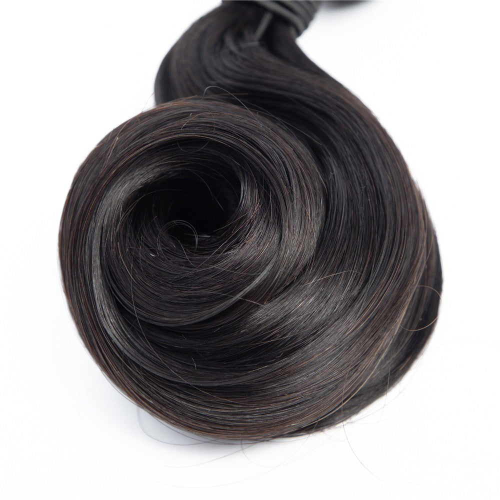 10A Grade Brazilian Egg Curl Fumi Human Hair Bundles with 4x4 closure, showcasing natural curls and high-quality texture.