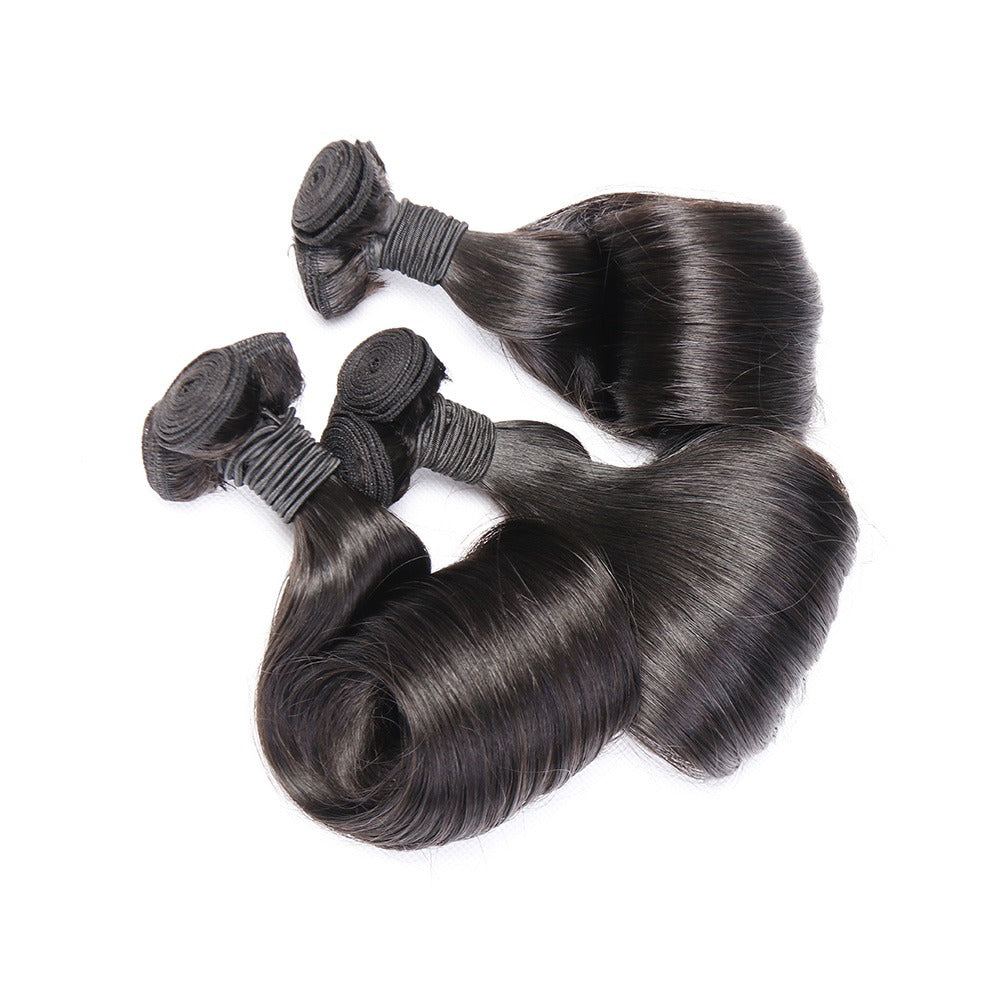 10A Grade Brazilian Egg Curl Fumi Human Hair Bundles with 4x4 closure, showcasing natural curls and high-quality texture.