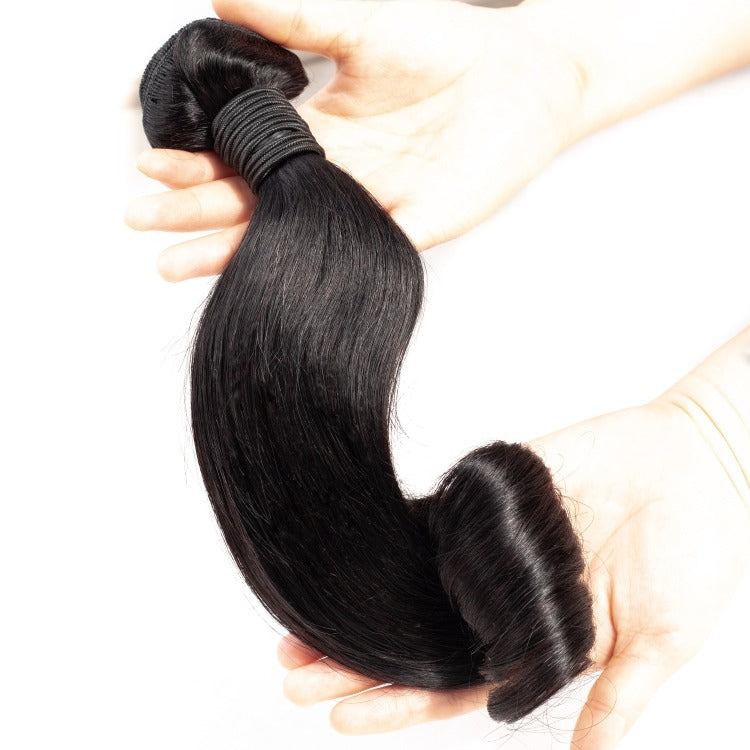 10A Grade Brazilian Egg Curl Fumi Human Hair Bundles with 4x4 closure, showcasing natural curls and high-quality texture.