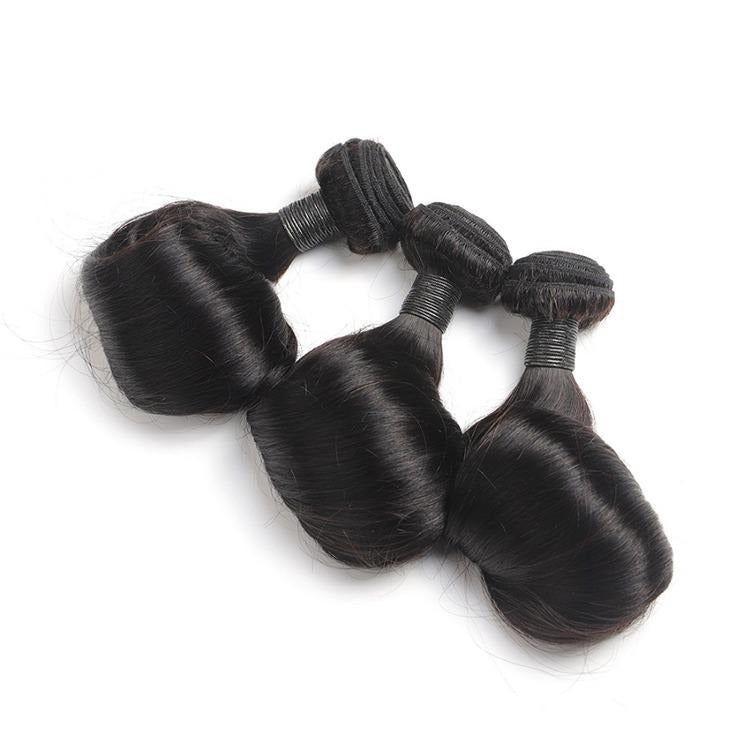 10A Grade Brazilian Egg Curl Fumi Human Hair Bundles with 4x4 closure, showcasing natural curls and high-quality texture.