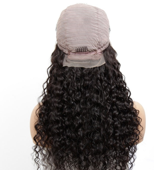 13x1x4 Jerry Curl Lace Wig in natural color, showcasing its soft curls and transparent lace for a realistic look.