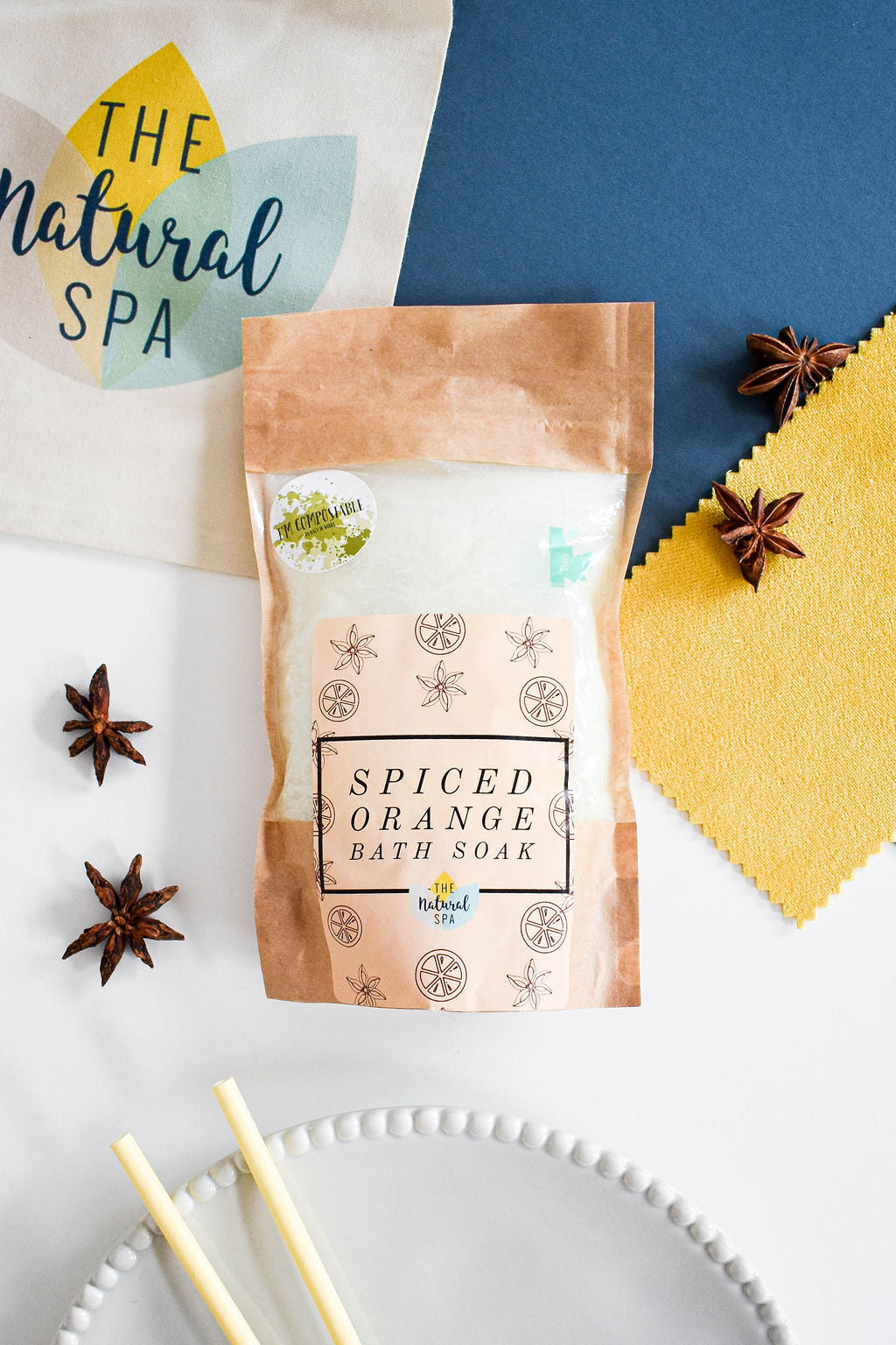 1kg Spiced Orange Bath Salts in a compostable pouch, showcasing vibrant orange crystals and eco-friendly packaging.