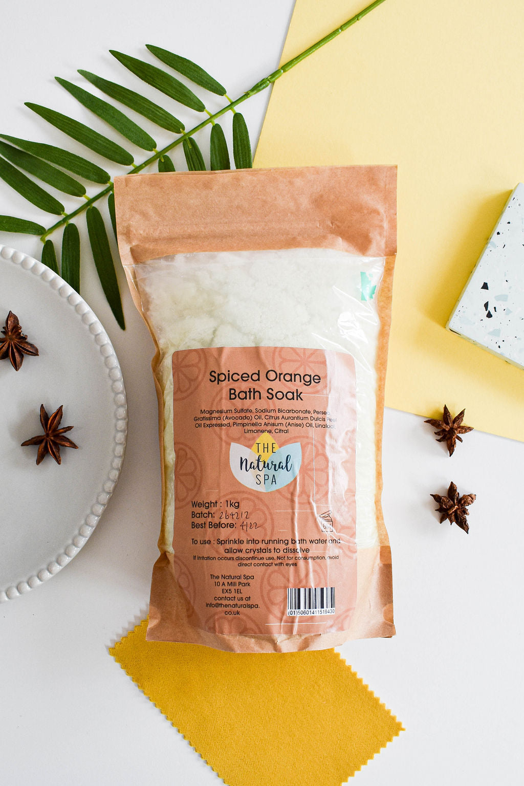 1kg Spiced Orange Bath Salts in a compostable pouch, showcasing vibrant orange crystals and eco-friendly packaging.