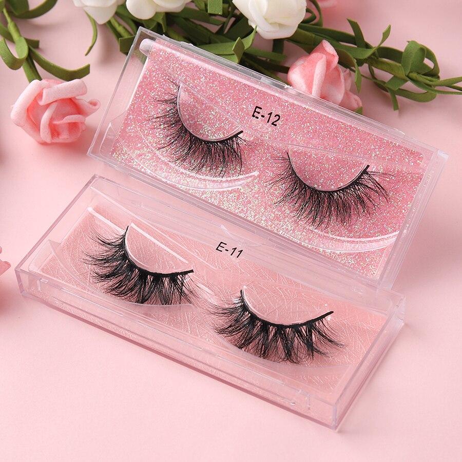 A pair of luxurious 3D mink eyelashes displayed in a glitter box, showcasing their natural wispy and fluffy design.