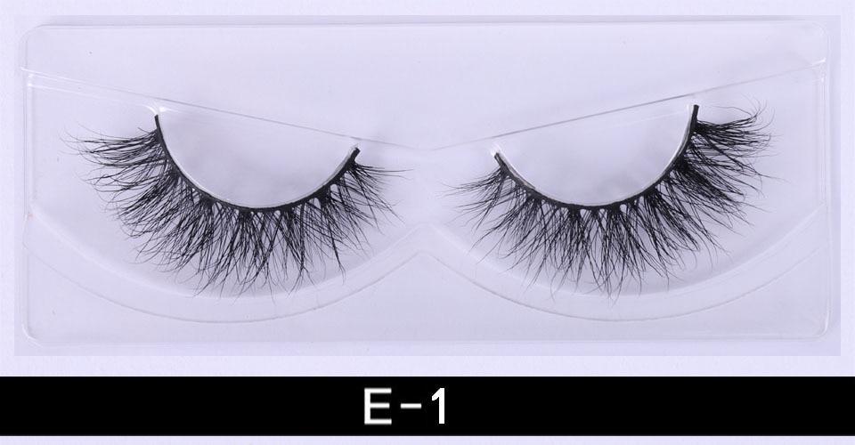 A pair of luxurious 3D mink eyelashes displayed in a glitter box, showcasing their natural wispy and fluffy design.