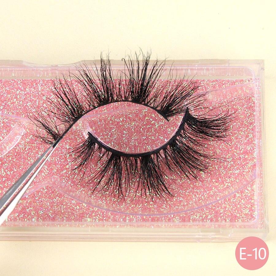 A pair of luxurious 3D mink eyelashes displayed in a glitter box, showcasing their natural wispy and fluffy design.