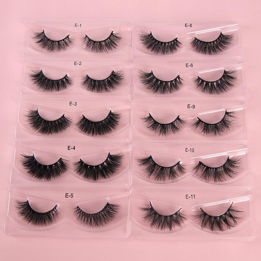 A pair of luxurious 3D mink eyelashes displayed in a glitter box, showcasing their natural wispy and fluffy design.