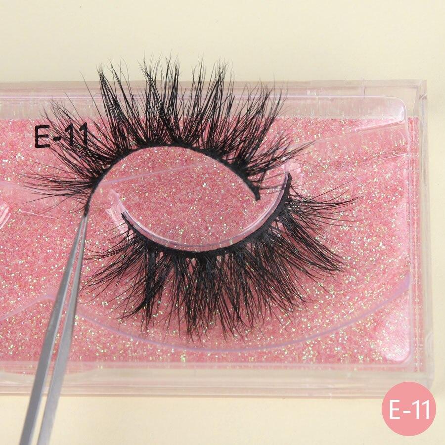 A pair of luxurious 3D mink eyelashes displayed in a glitter box, showcasing their natural wispy and fluffy design.