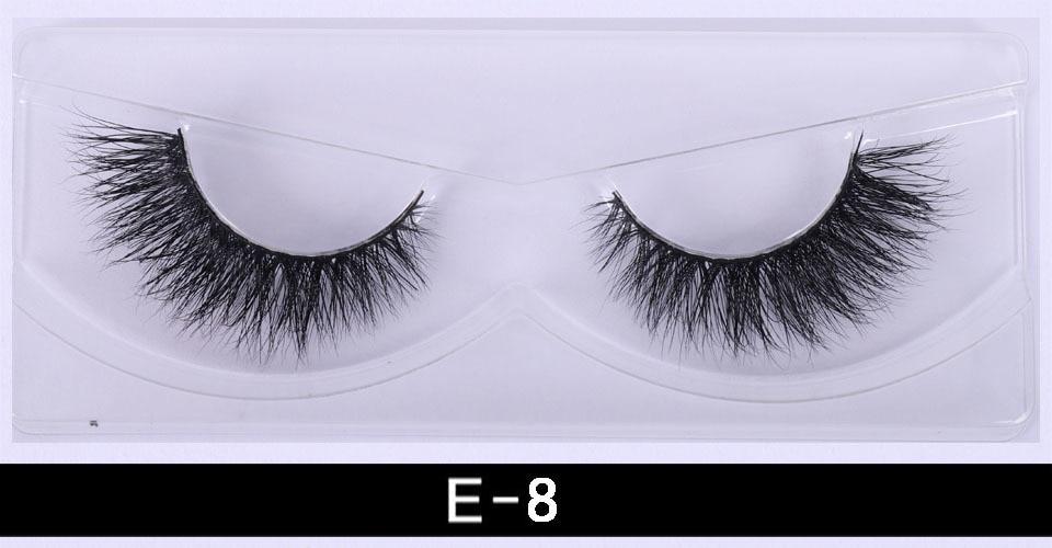 A pair of luxurious 3D mink eyelashes displayed in a glitter box, showcasing their natural wispy and fluffy design.