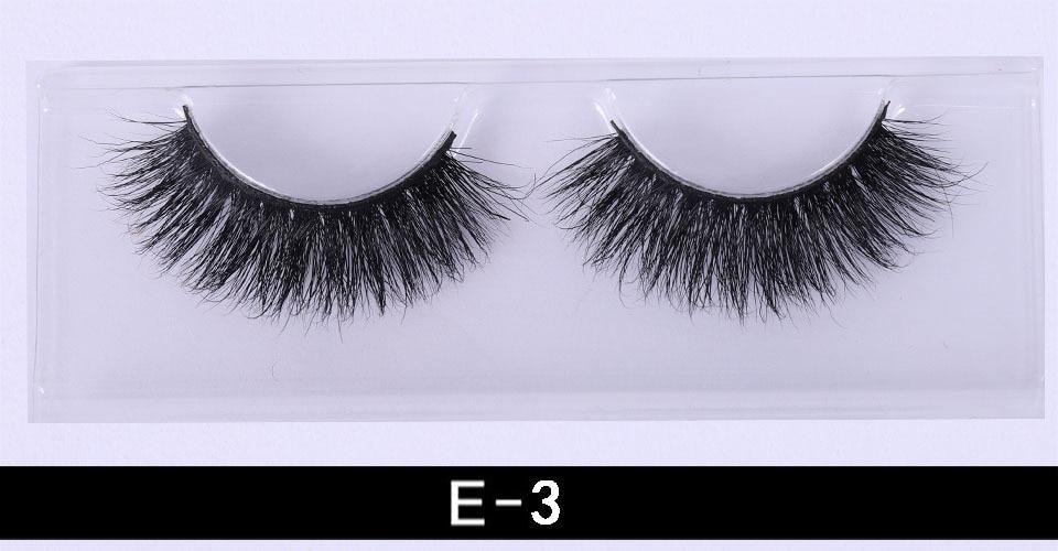 A pair of luxurious 3D mink eyelashes displayed in a glitter box, showcasing their natural wispy and fluffy design.