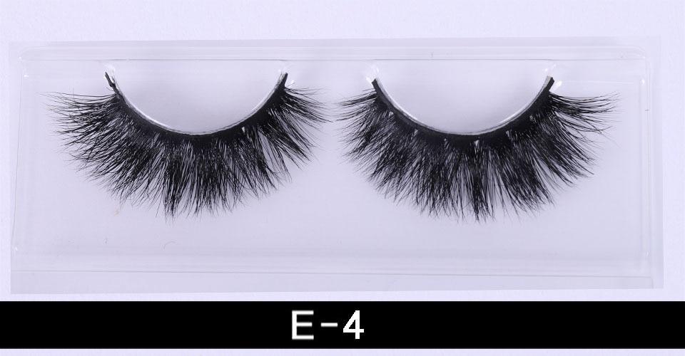 A pair of luxurious 3D mink eyelashes displayed in a glitter box, showcasing their natural wispy and fluffy design.