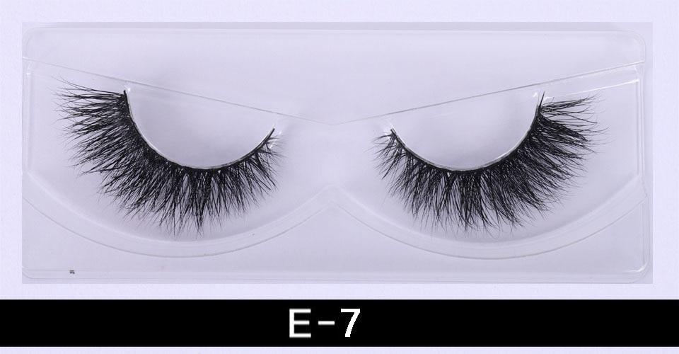 A pair of luxurious 3D mink eyelashes displayed in a glitter box, showcasing their natural wispy and fluffy design.