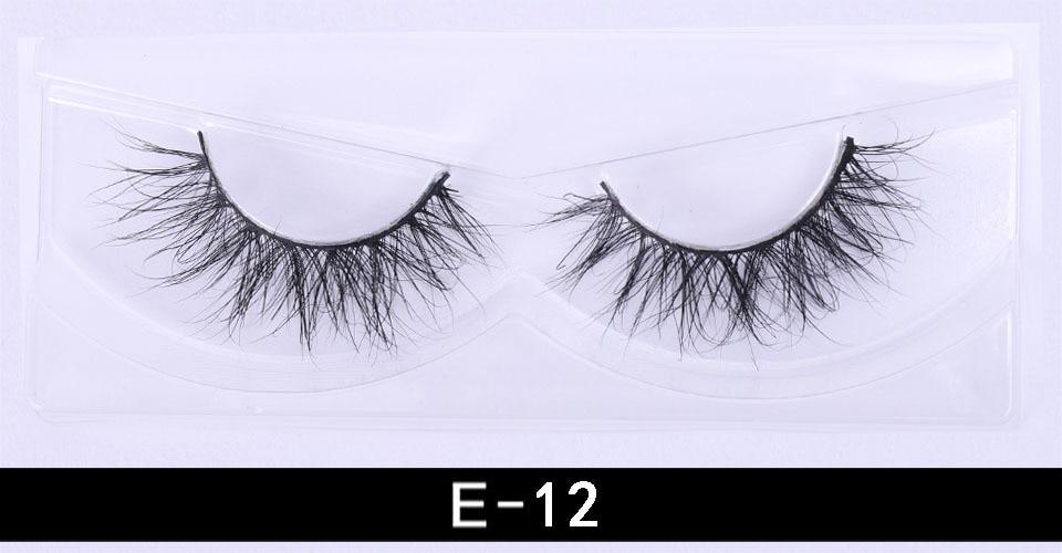 A pair of luxurious 3D mink eyelashes displayed in a glitter box, showcasing their natural wispy and fluffy design.