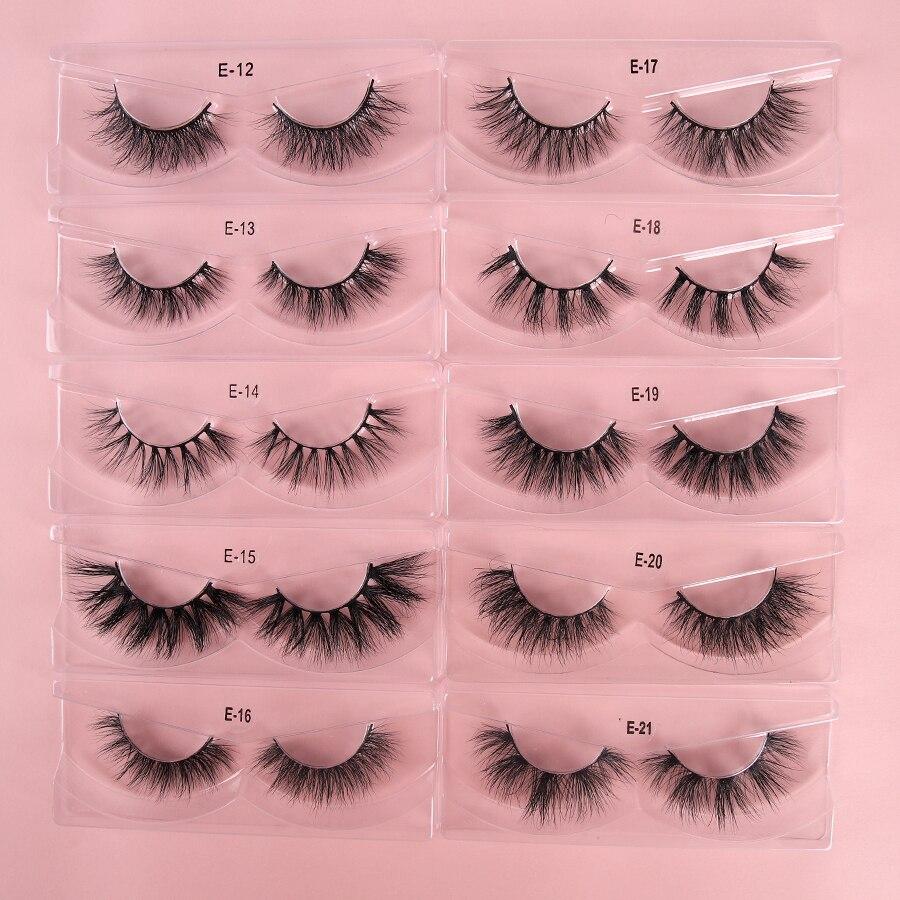 A pair of luxurious 3D mink eyelashes displayed in a glitter box, showcasing their natural wispy and fluffy design.