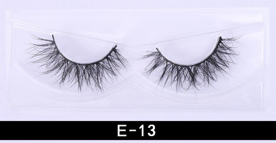 A pair of luxurious 3D mink eyelashes displayed in a glitter box, showcasing their natural wispy and fluffy design.