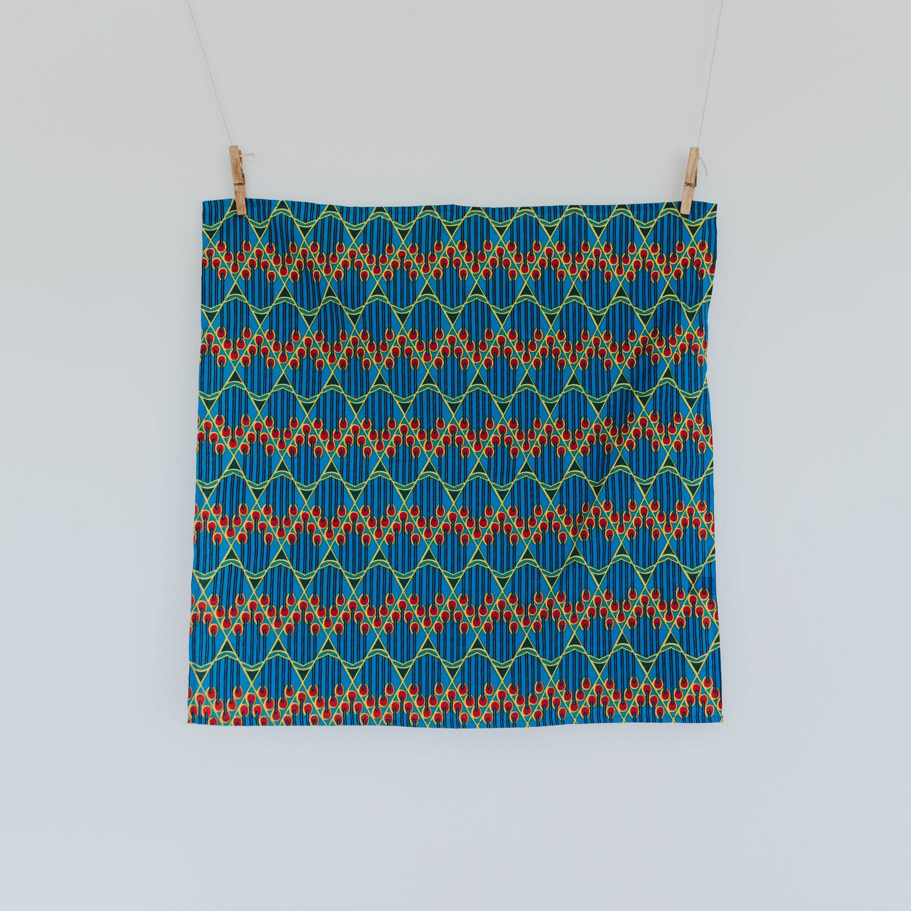 Two vibrant Furoshiki inspired Ankara Gift Wraps showcasing intricate patterns, perfect for eco-friendly gifting.