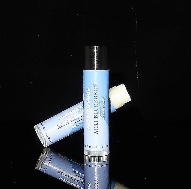 Acai Blueberry Kisser Cream lip balm tube with natural ingredients, featuring a vibrant design and sweet berry flavor.