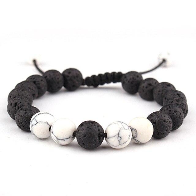 Adjustable Anxiety Diffusing Lava Stone Bracelet featuring black lava stones and white stones, designed for essential oil absorption.