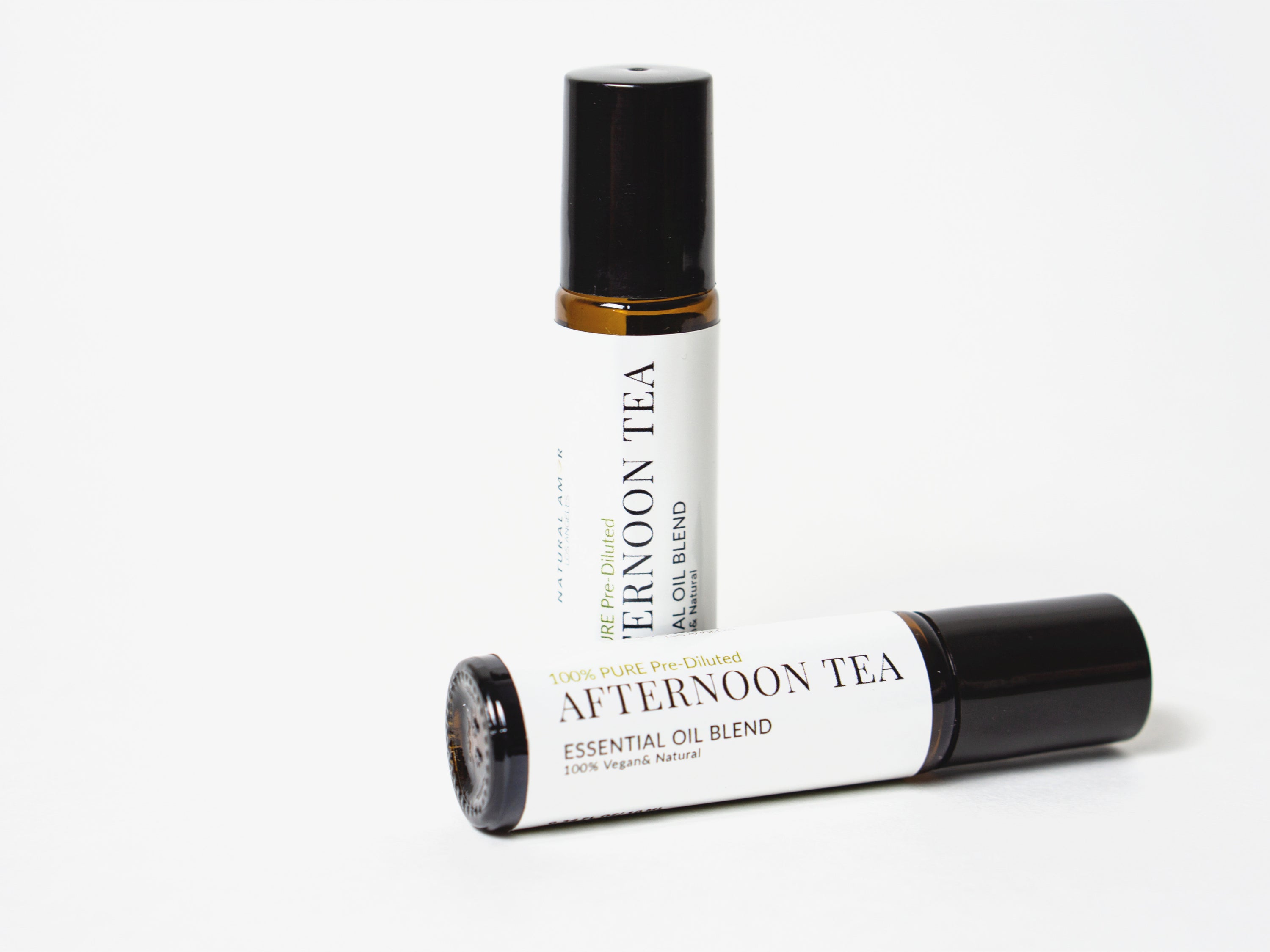 Afternoon Tea Roll On Essential Oil Blend in a 10 mL bottle with a stainless steel rollerball, showcasing its calming and balancing properties.