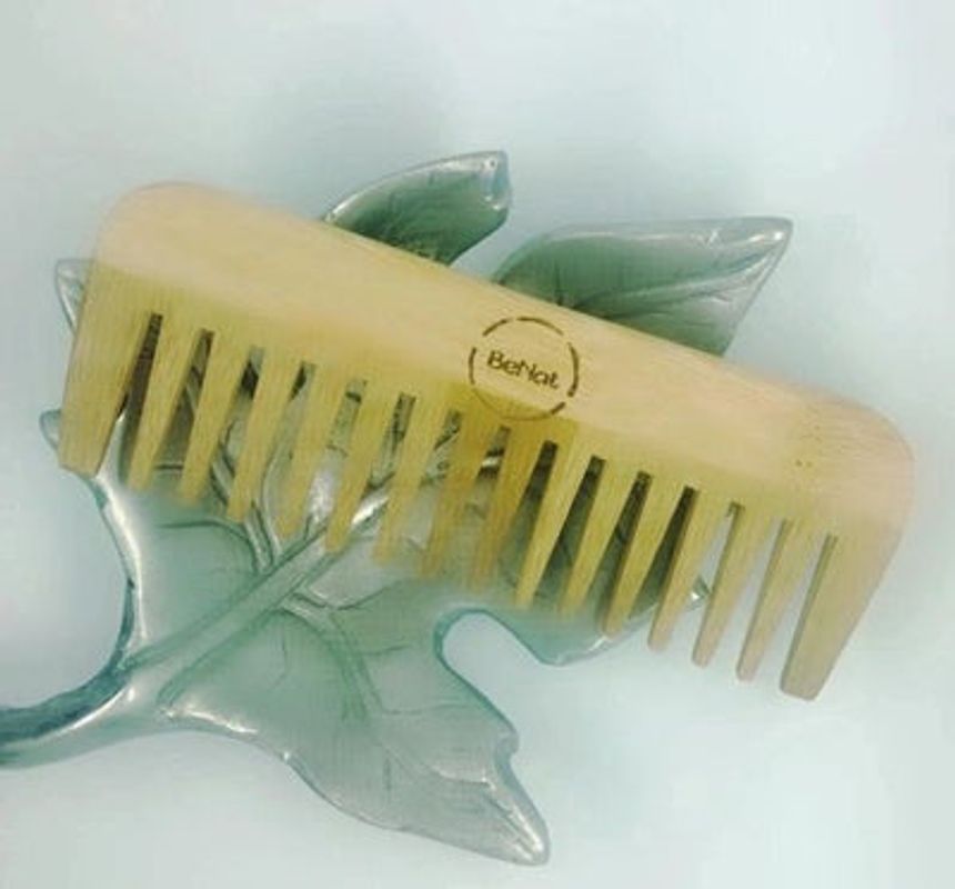 All-Natural Bamboo Hair Comb, eco-friendly grooming tool for men and women, promoting healthy hair growth and scalp care.