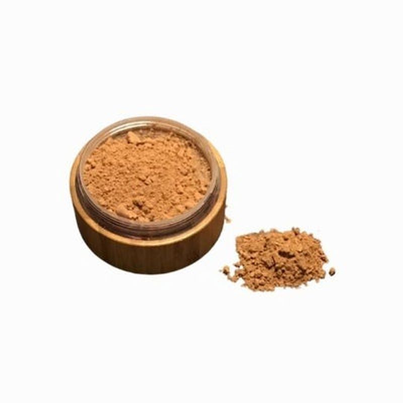 All-Natural Bronzer Loose Powder in a bamboo container with a sifter, showcasing its eco-friendly packaging and natural ingredients.