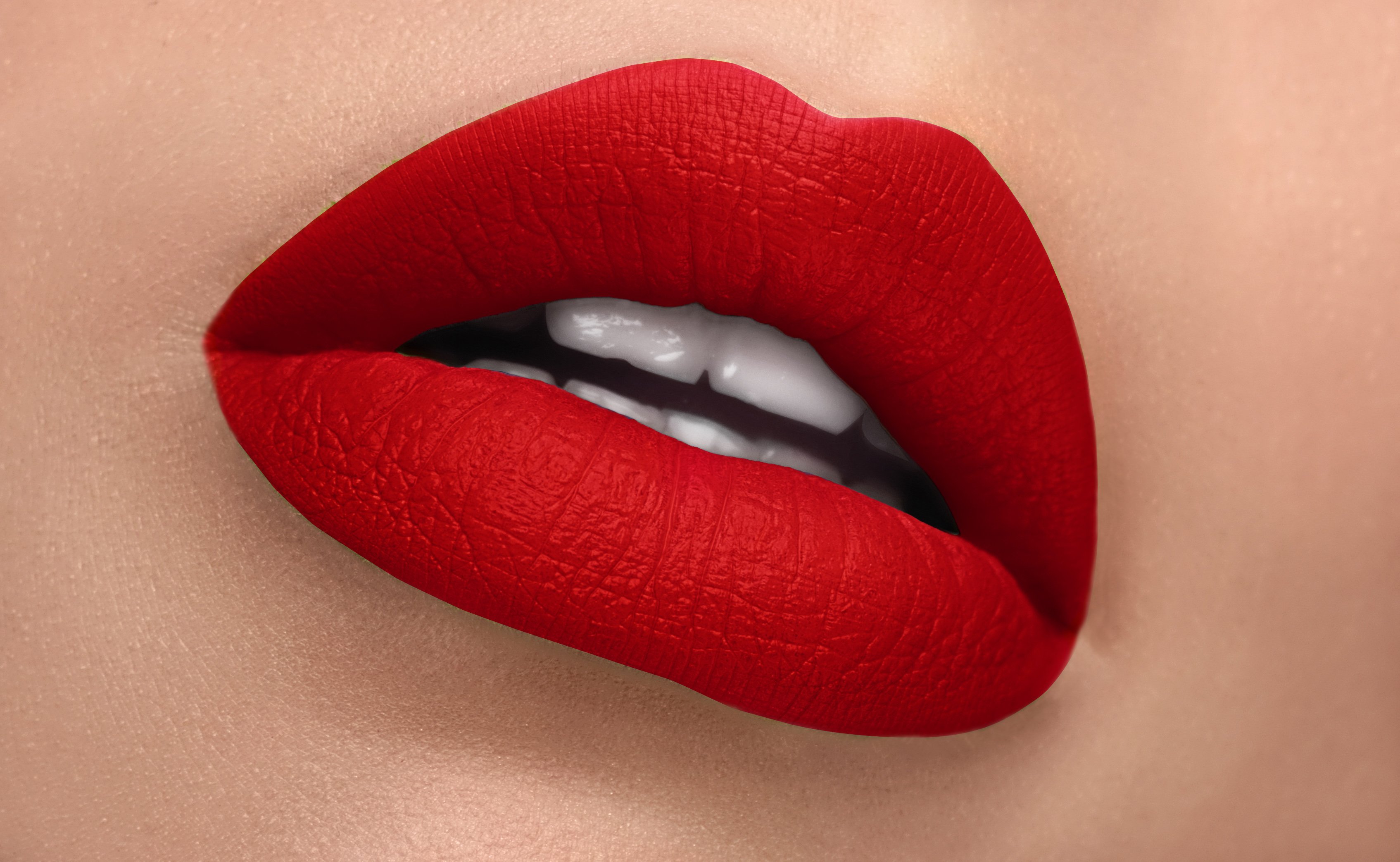 Allure Silk-Matte Lipstick in Strawberry Red, showcasing its luxurious packaging and vibrant color.