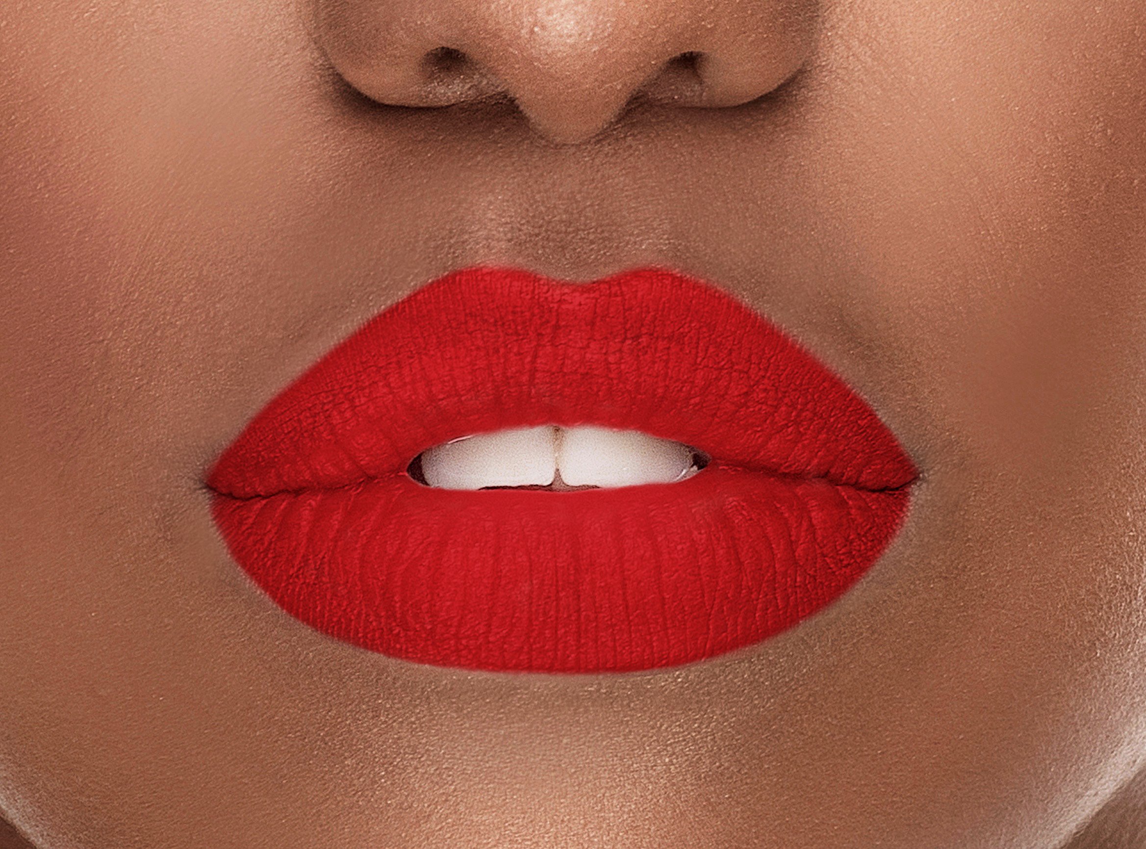 Allure Silk-Matte Lipstick in Strawberry Red, showcasing its luxurious packaging and vibrant color.