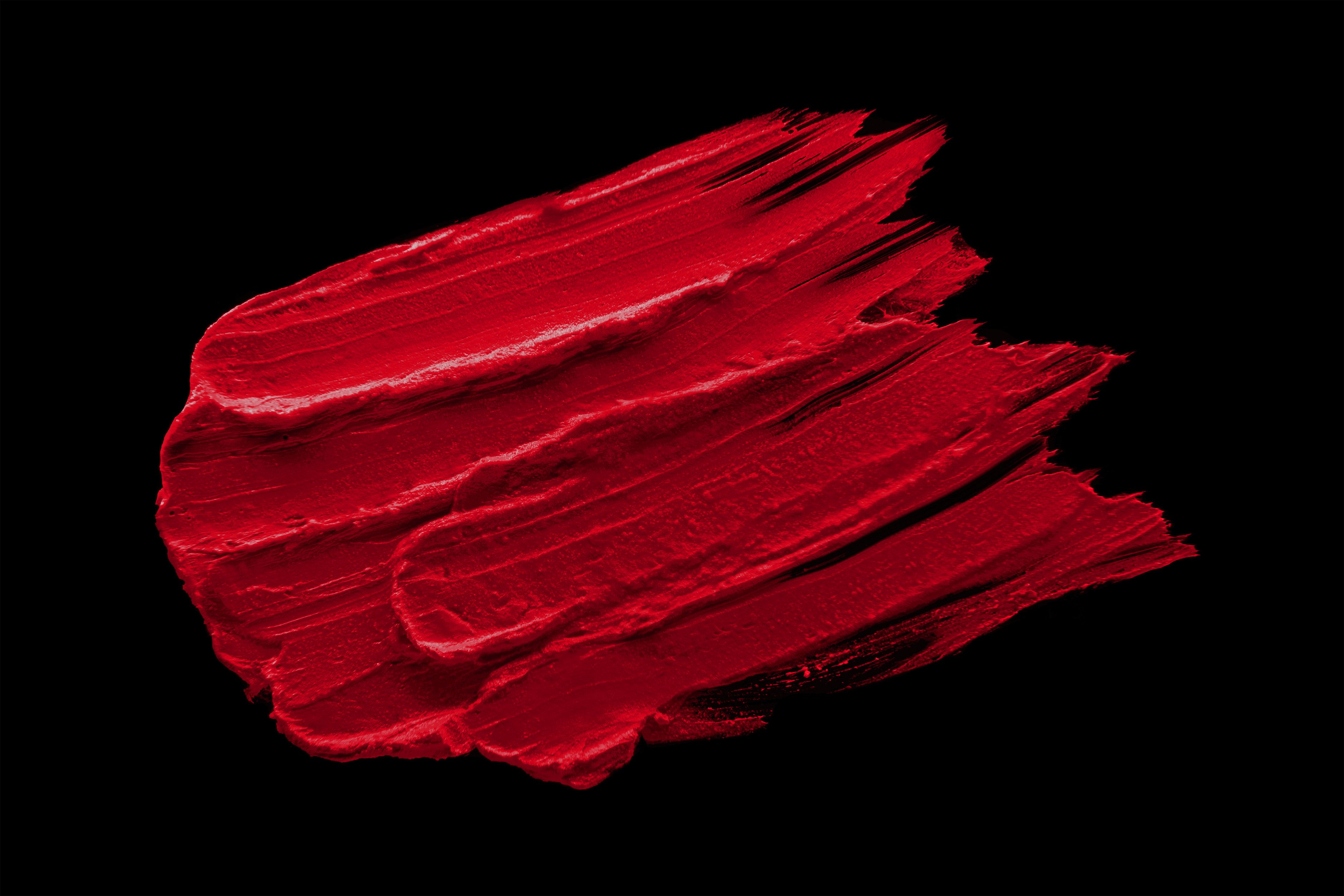 Allure Silk-Matte Lipstick in Strawberry Red, showcasing its luxurious packaging and vibrant color.