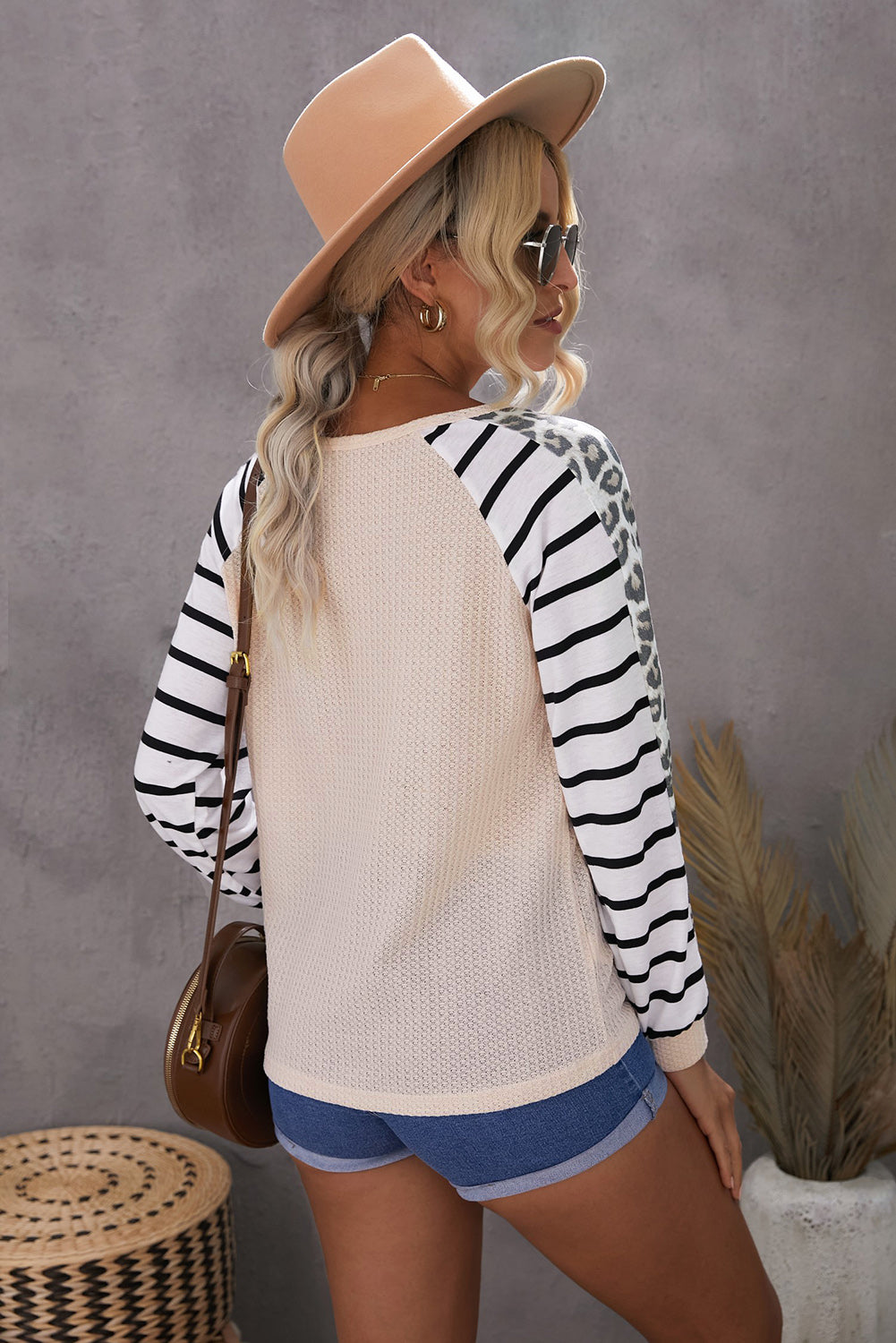 Animal Striped Sleeve Patchwork Waffle Knit Top featuring v-neckline, color block sleeves with stripes and leopard print.