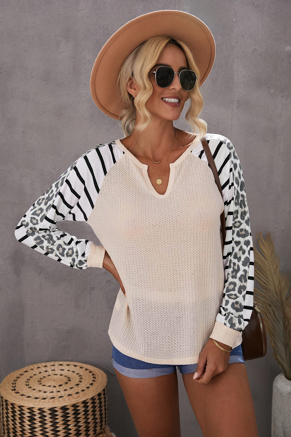 Animal Striped Sleeve Patchwork Waffle Knit Top featuring v-neckline, color block sleeves with stripes and leopard print.