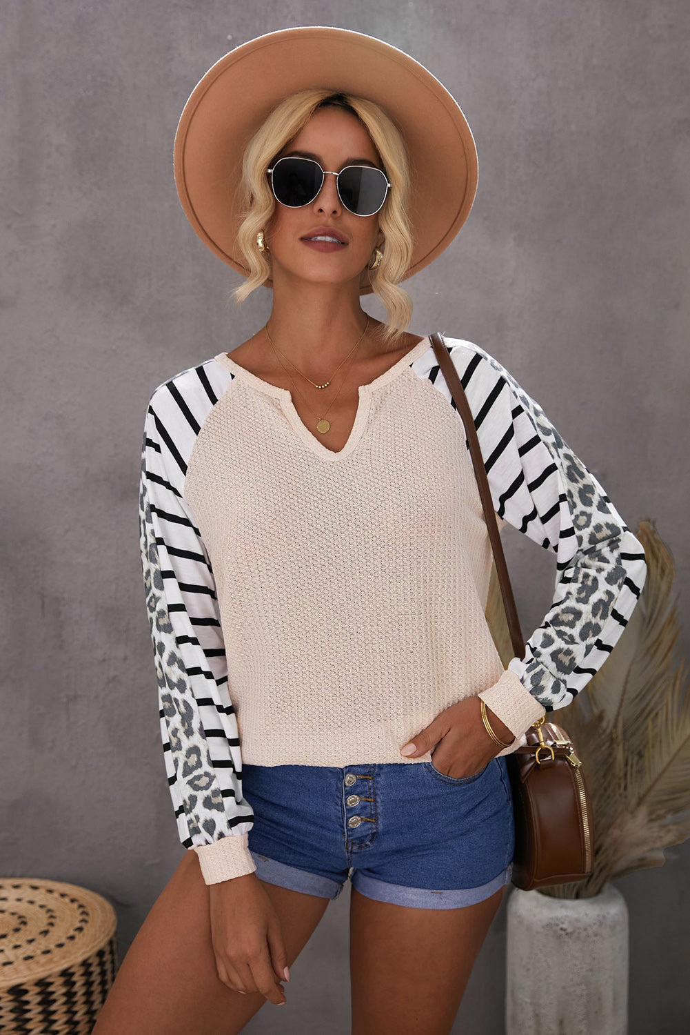 Animal Striped Sleeve Patchwork Waffle Knit Top featuring v-neckline, color block sleeves with stripes and leopard print.