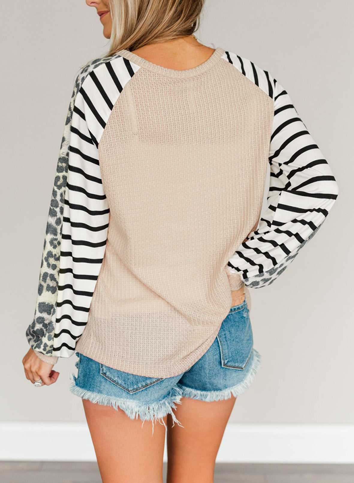 Animal Striped Sleeve Patchwork Waffle Knit Top featuring v-neckline, color block sleeves with stripes and leopard print.